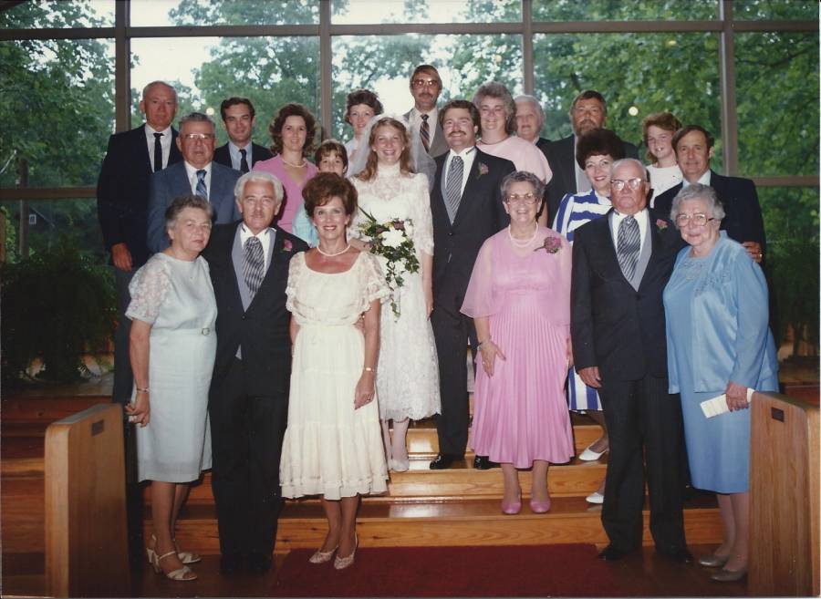 Michael Byron Randall & Hilaray Hunter Orr-Randall - Wedding party. June 7,
1986. Back row: James Deavor, Patsy Brown-Roberts, James Roberts & Alice
Farr-Clarke. 2nd row from back: Jimmy Brown, unknown child, Elizabeth Sara
Randall-Canady, Don Canady & Michelle Canady. 3rd row from back: Byron Clarke,
Hilary Hunter Orr-Randall, Michael Byron Randall, Priscilla Randall-Watson &
Duke Watson. 4th row from back: V.O Brown-Randall. Front row: Lucy
Clarke-Deavor, Walter Clarke Randall, Pattricia Brady-Randall, Walter Baxter...