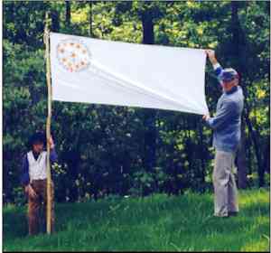 The 34th Georgia Infantry Regimental Flag. At right is Jerry Bishop, the great-great-grandson of 2nd Sgt. John T. Hasty of the 34th GA, Co. B. Pictured on the left is Morgan Adams, the great-great-great-great-grandson of 2nd Sgt. Hasty. \\ Source: [[http://www.battleofraymond.org/flag.htm|http://www.battleofraymond.org/flag.htm]]
