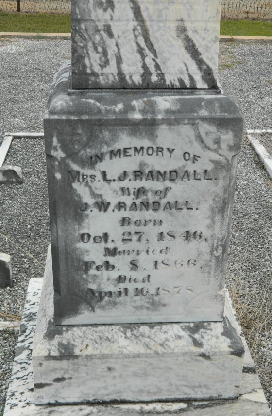 Tombstone for Lucinda (Lule) Jane Cleveland Randall inscribed: "In Memory of Mrs. L.J. Randall. Wife of J.W. Randall. Born Oct. 27, 1846. Married Feb.  8, 1866. Died April 16, 1878".