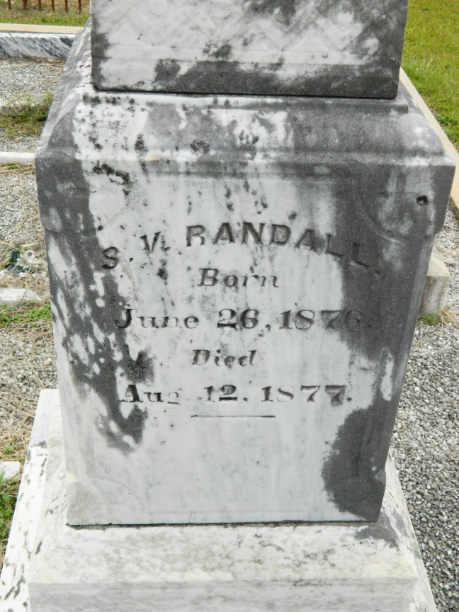Tombstone inscribed: "S. V. Randall. Born June 26, 1876. Died Aug. 12, 1877."