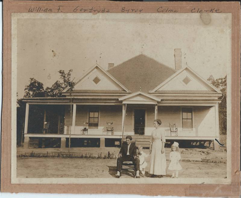 William F. Clarke, Byron Clarke, Gertrude Clarke & Colma Clarke outside their home. Circa 1913.