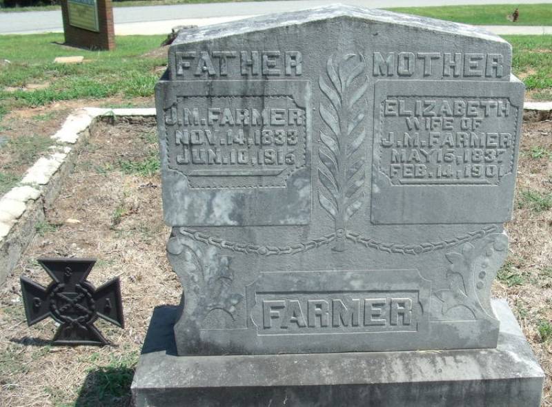  The tombstone reads: "J.M. Farmer, Nov. 14, 1833 - Jun. 10, 1915" & "Elizabeth, Wife of J.M. Farmer, May 15, 1837 - Feb. 14, 1901"